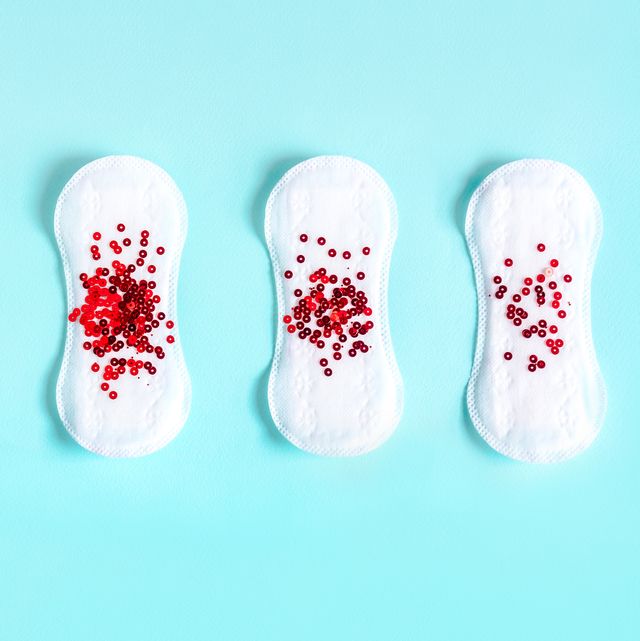 Menstrual pads with red glitter on colored background - menopause quiz