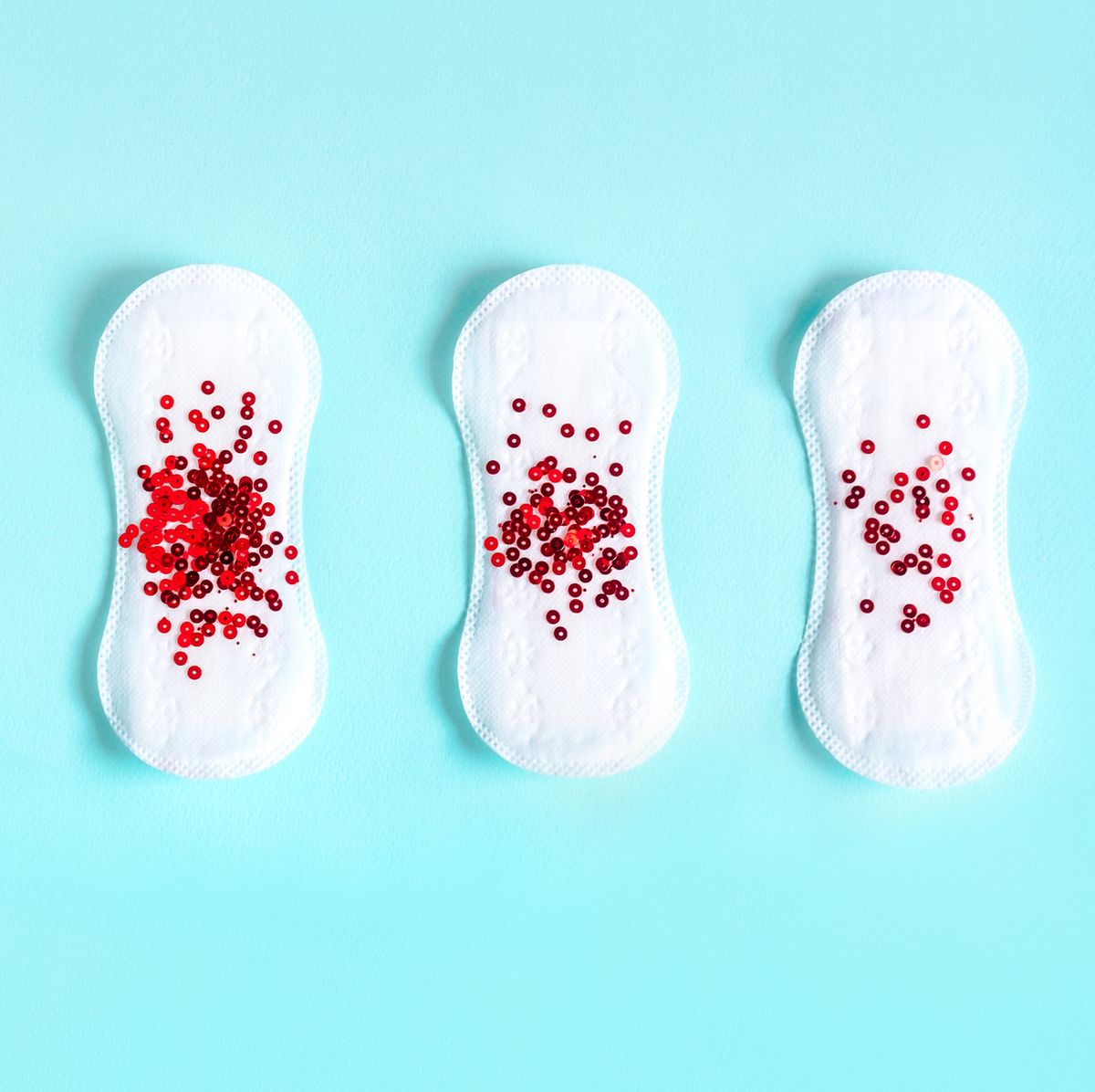 menstrual pads with red glitter on colored background   menopause quiz