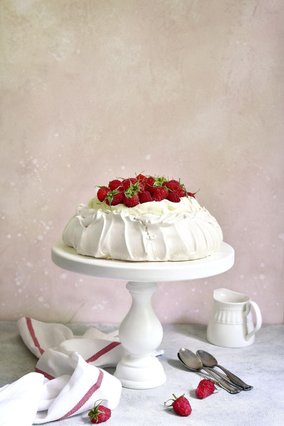 meringue cake "pavlova" with fresh ripe raspberry and whipped cream