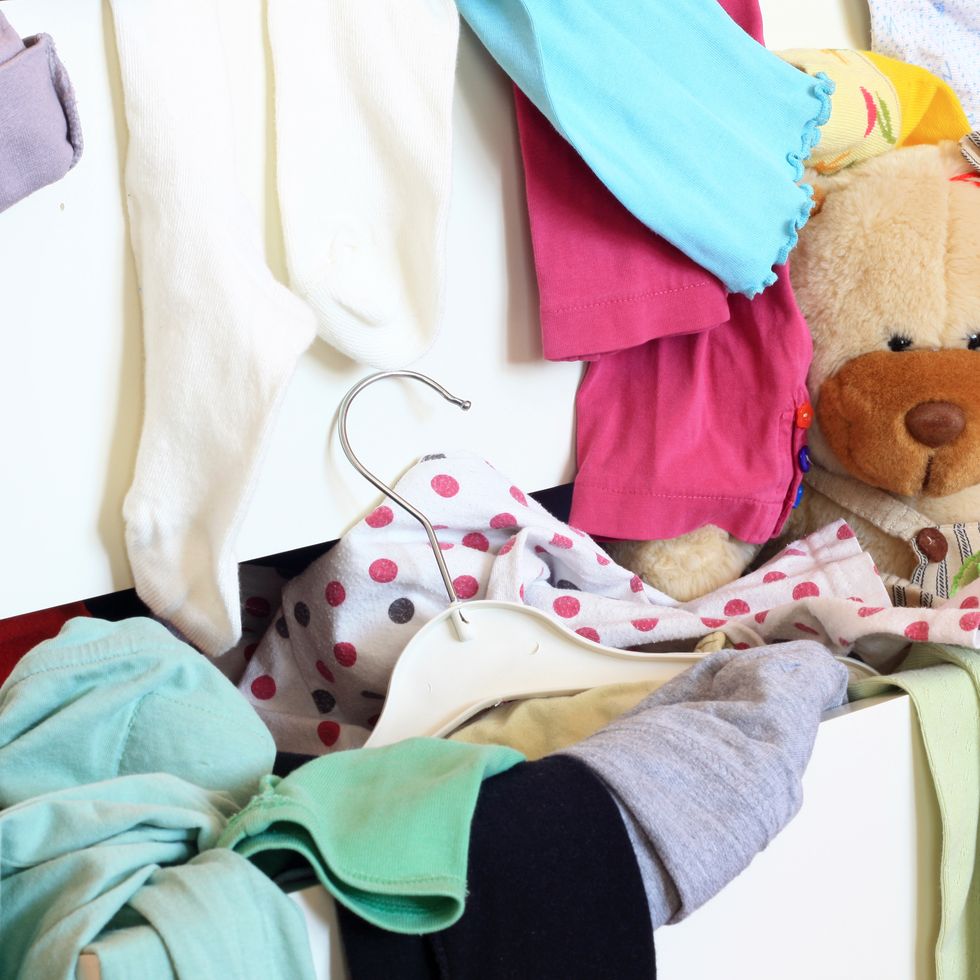 disorganized kids clothes in drawer