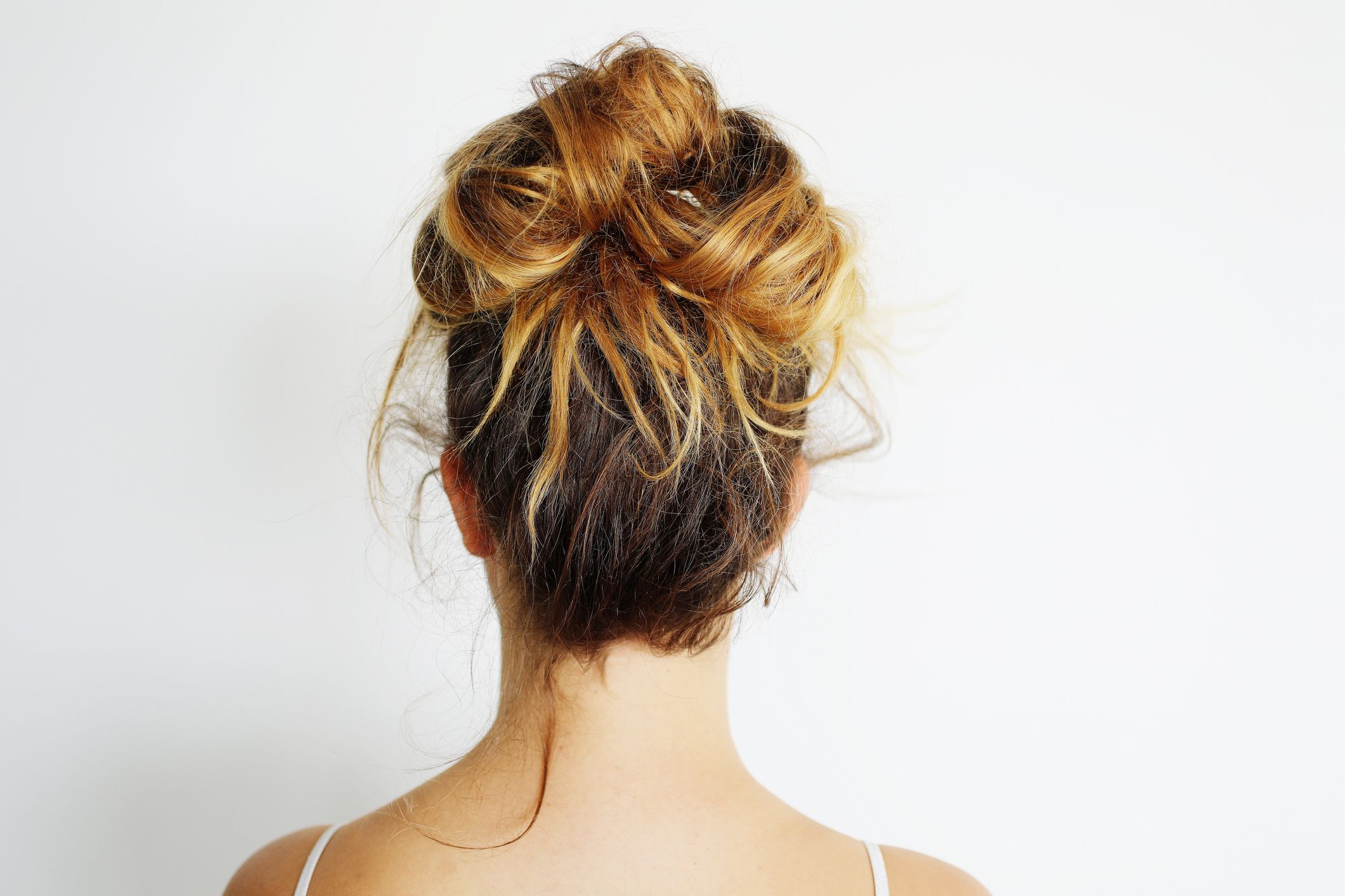 braided bun hairstyle with bangs