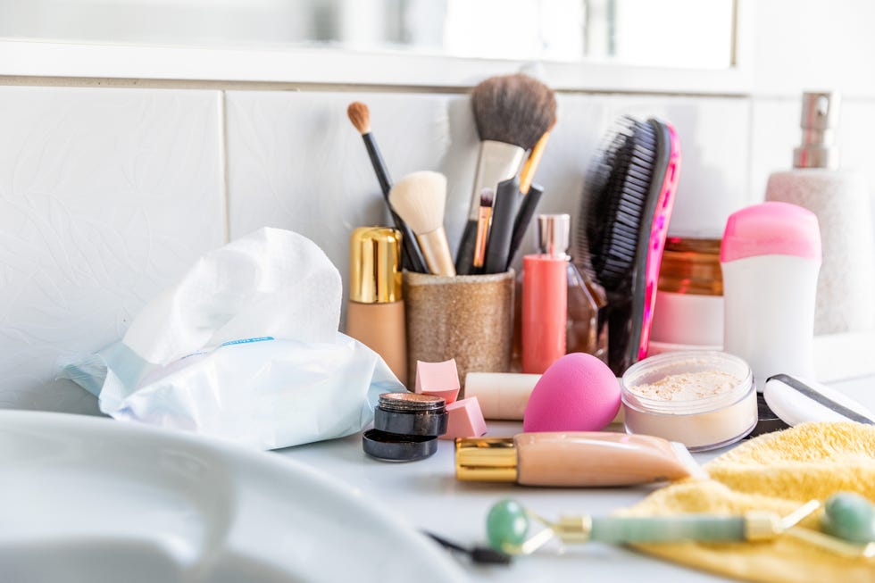 messy cosmetics displayed in a bathroom