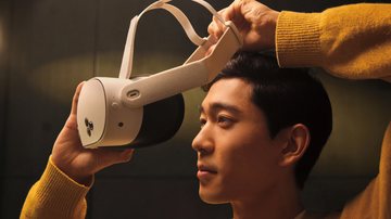 a person adjusting a virtual reality headset