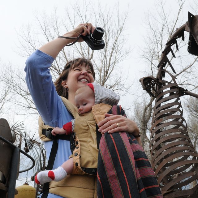 KL Metal sculptures were moved at the Swetsville Zoo on Monday, March 16, to make way for the widening of Harmony Road east of Interstate 25 by the Town of Timnath. Rebekah Walston, from Fort Collins, holds her son Joshua Walston, 5 months old, while she
