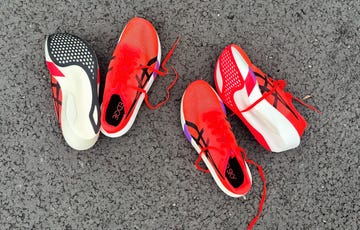 two pairs of red and black cushioning shoes designed for racing