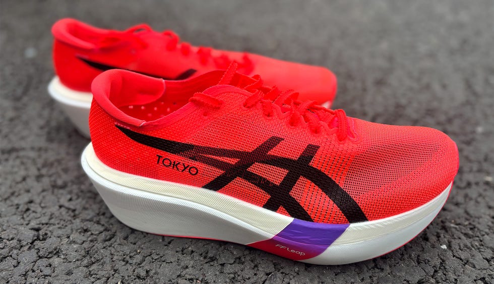 a pair of red and black asics running shoes