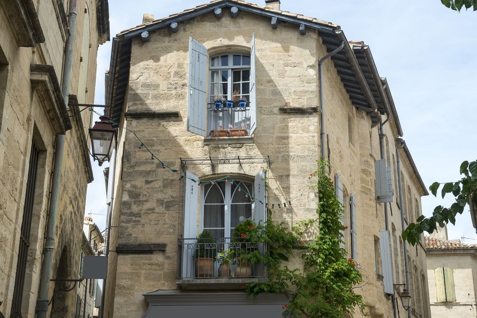 uzes gard, languedoc roussillon, france old typical house with flowers