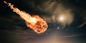 interstellar meteor falling through starry night sky over water