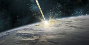 A meteor strikes Earth. Clouds cover an ocean area of the planet. Planetary material is ejected back into space.