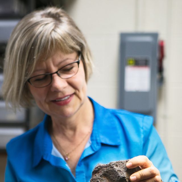 Professor Monaliza Sirbescu shows off a meteorite.