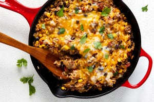 mexican beef 'n rice skillet topped with melty cheese and cilantro