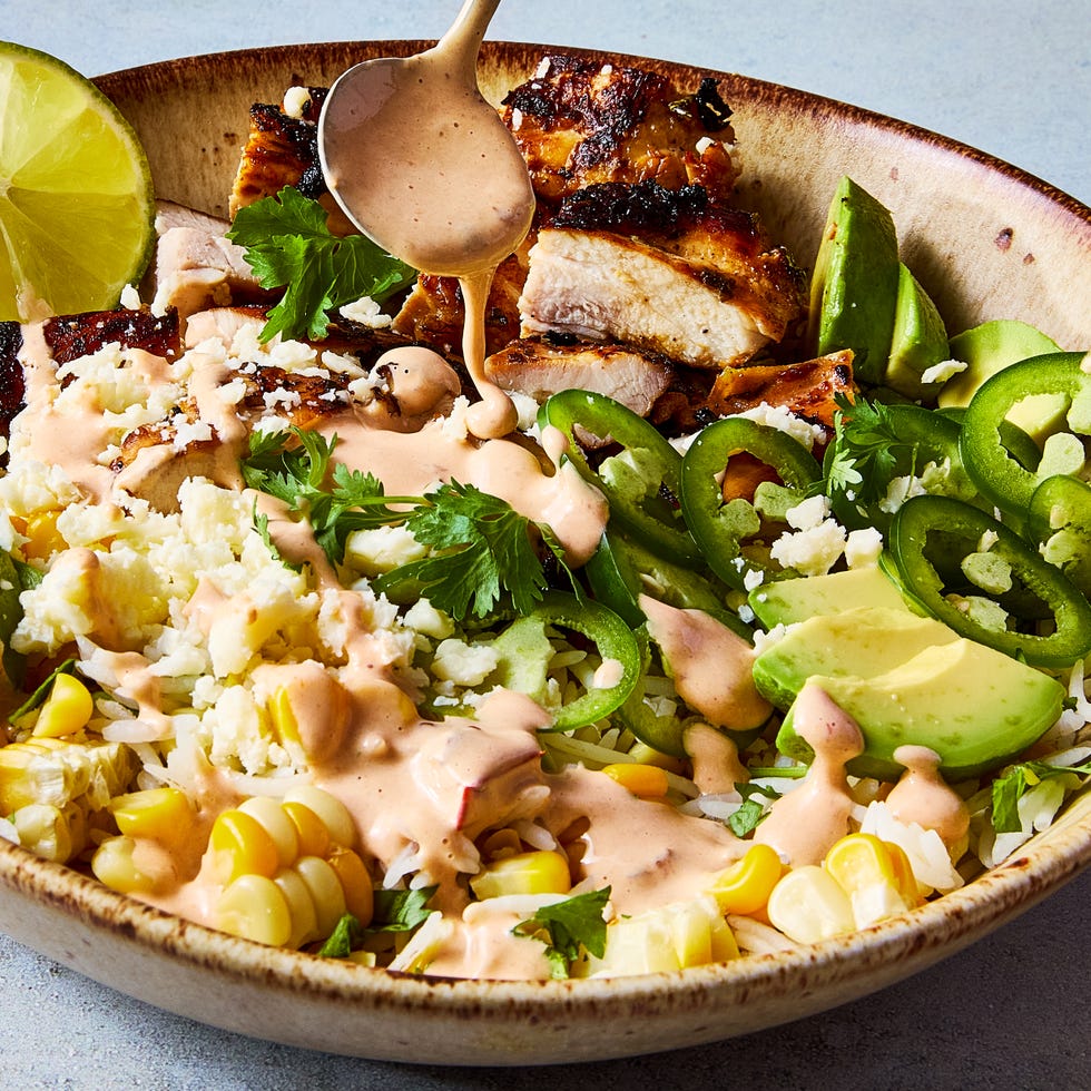 rice bowl filled with chicken, corn, avocado, and jalapeno slices
