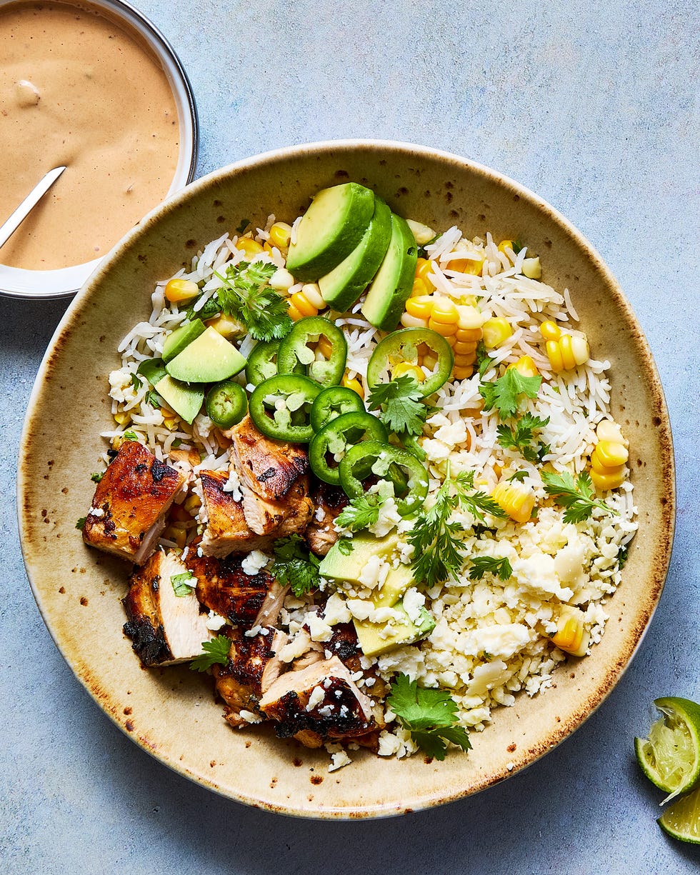 rice bowl filled with chicken, corn, avocado, and jalapeno slices