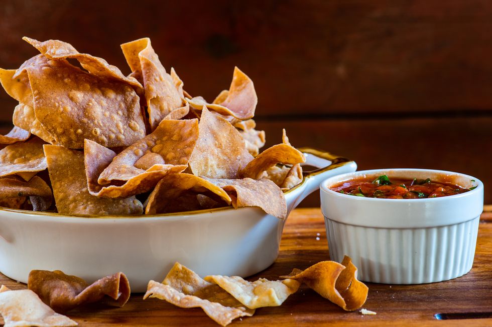 healthy snacks - mexican corn tortilla chips with tomato salsa dip