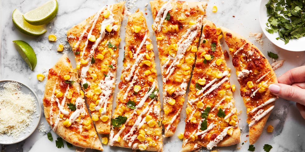 flatbread topped with corn, cheese, and cilantro