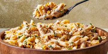 pasta salad tossed in a creamy sauce, corn, and cilantro