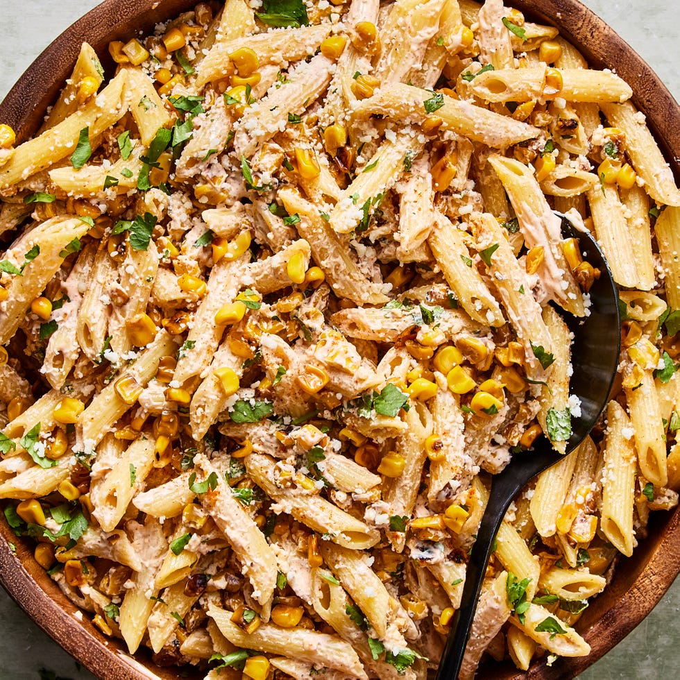 pasta salad tossed in a creamy sauce, corn, and cilantro