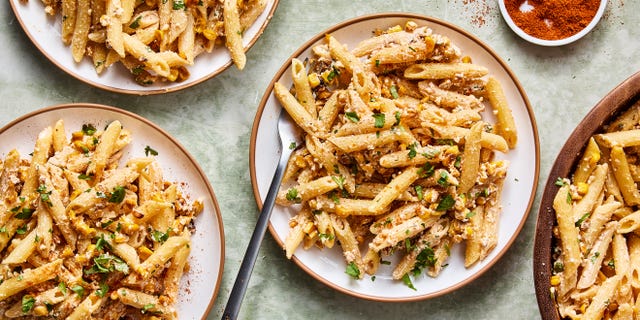 pasta salad tossed in a creamy sauce, corn, and cilantro