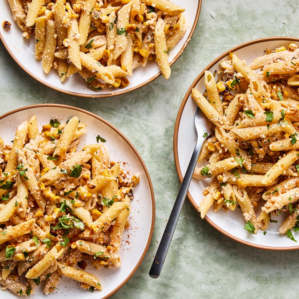 pasta salad tossed in a creamy sauce, corn, and cilantro