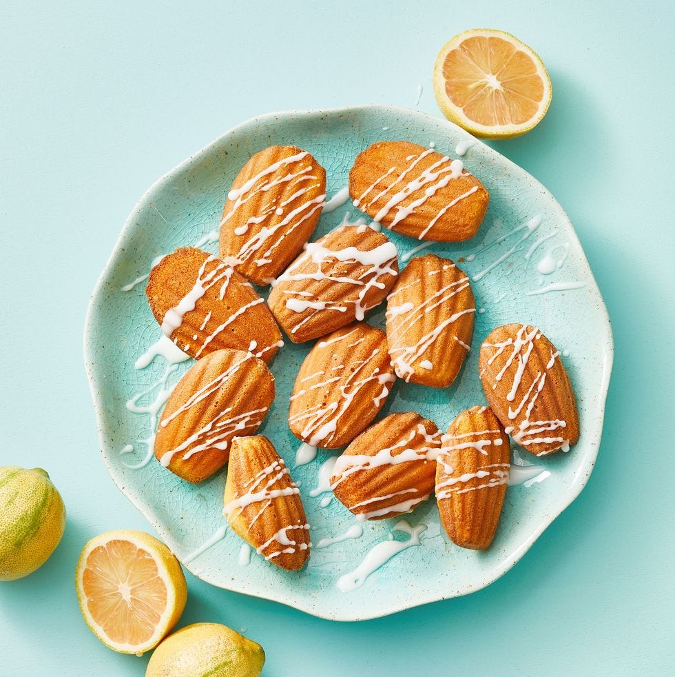 meyer lemon madeleines with icing drizzled on top