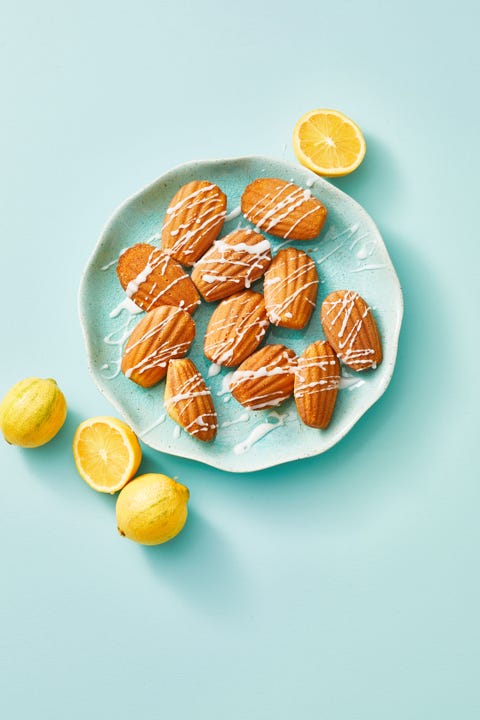 Meyer Lemon Madeleines on a blue plate meyer lemon madeleines with drizzle