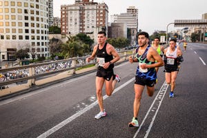 buenos aires, argentina 20220821 a group of elite athletes runs along the illia highway while the general squad heads in the opposite direction along july 9th avenue towards the obelisk area of buenos aires 21k buenos aires 20 thousand people filled the streets of buenos aires with color with the half marathon the international competition recovered all its splendor with more than 150 elite runners and a large number of athletes from all over the world photo by nacho boullosasopa imageslightrocket via getty images