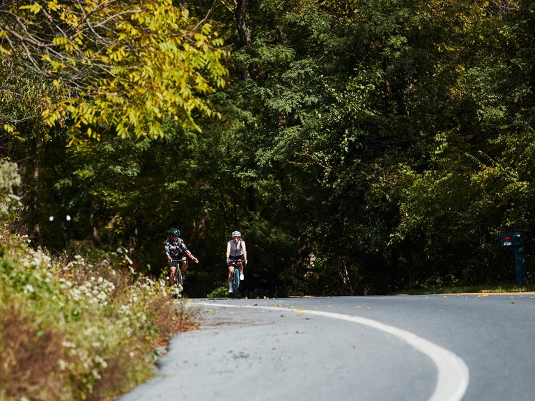 selene yeager and amy wolff riding bikes in machines for freedom