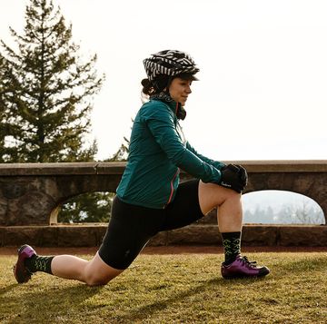a female cyclist stretching