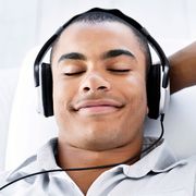 a diptych of a man with headphones on one side and a couple having sex on the other