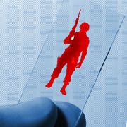 split image of soldier on medical slide in red and man with head in his hands