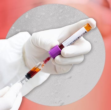 hands with rubber gloves working with a blood sample