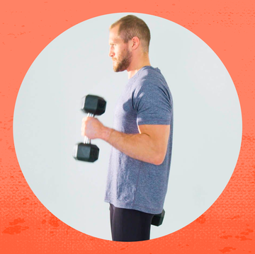 a man holding a dumbbell