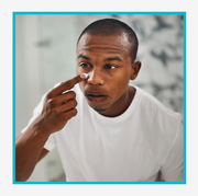 kiehl's acne spot treatment product and man applying acne spot treatment