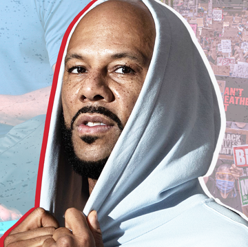 common in a hoodie with a background of man in lotus pose and black lives matter signs