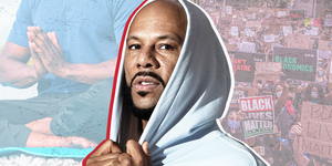 common in a hoodie with a background of man in lotus pose and black lives matter signs