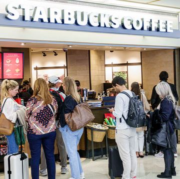 miami, florida, miami international airport, starbucks coffee shop with line of customers waiting to order