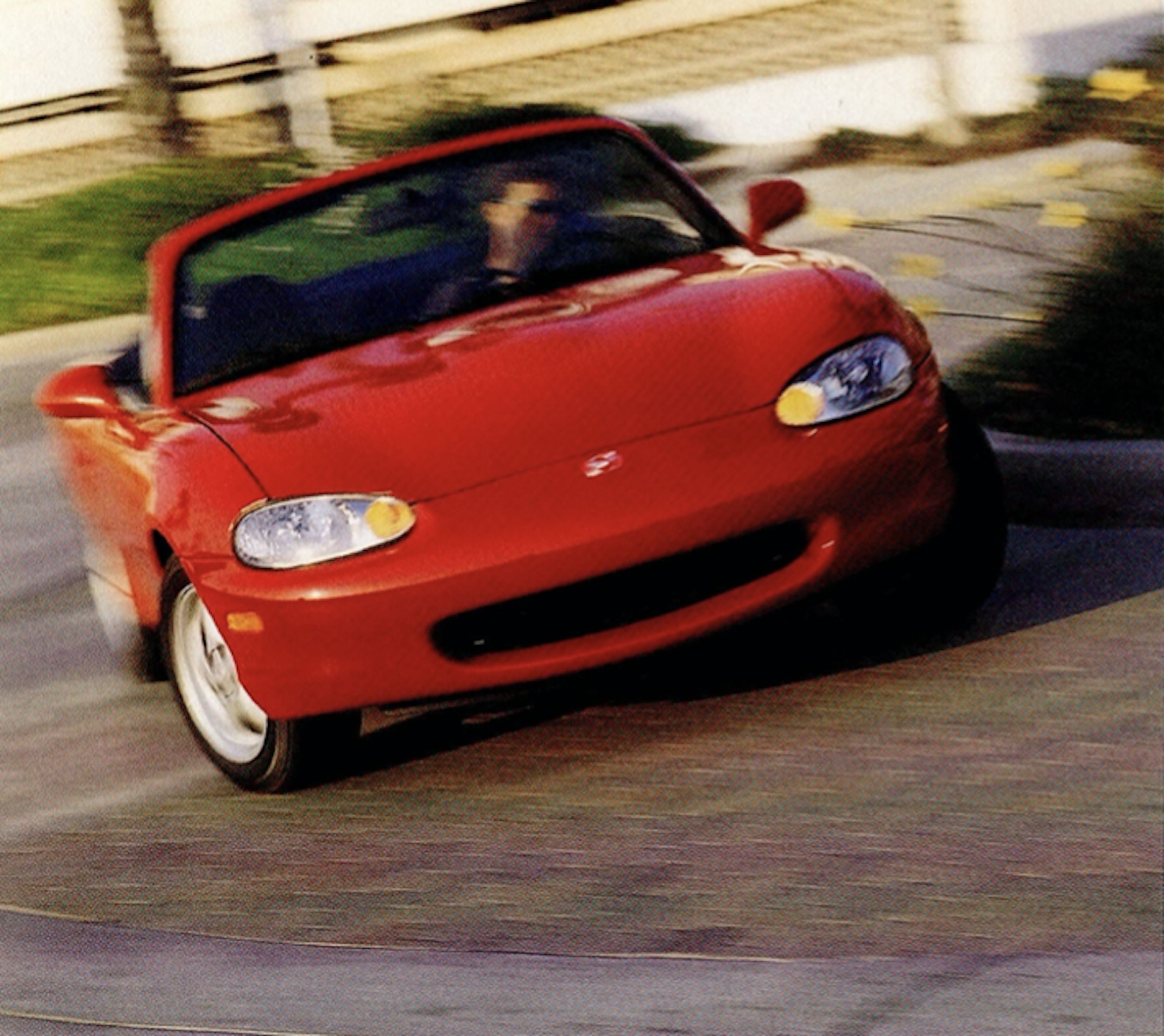 1999 Mazda Miata Review: Makes You Feel Like You're Falling in