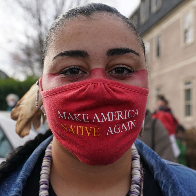 https://hips.hearstapps.com/hmg-prod/images/micah-stasis-wearing-a-mask-with-the-words-make-america-news-photo-1700752339.jpg?crop=0.66675xw:1xh;center,top&resize=640:*