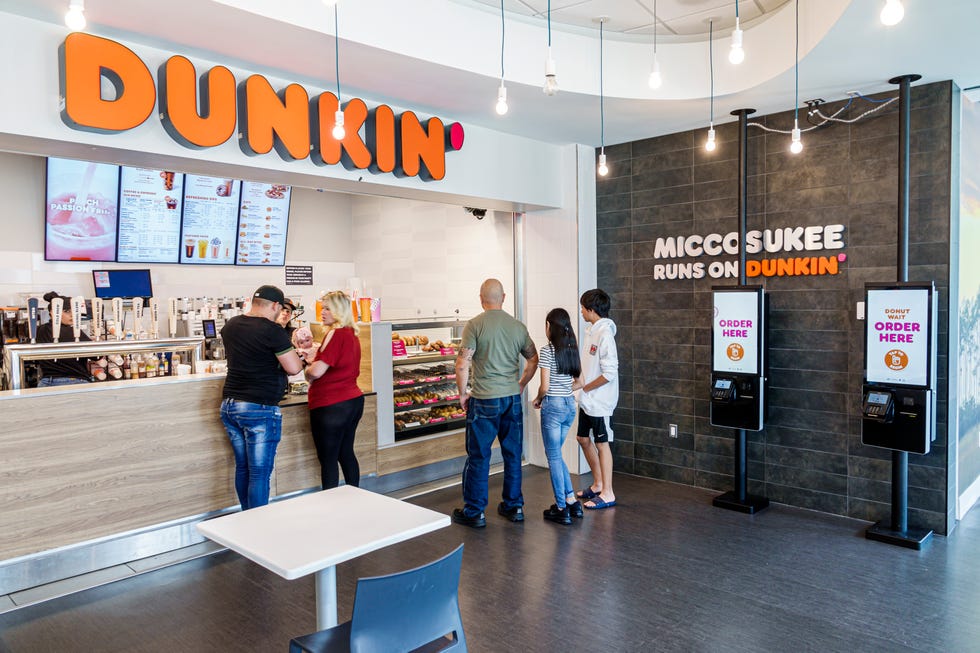 miccosukee indian reservation, florida everglades, service plaza, dunkin' donuts customers using touch screen kiosk