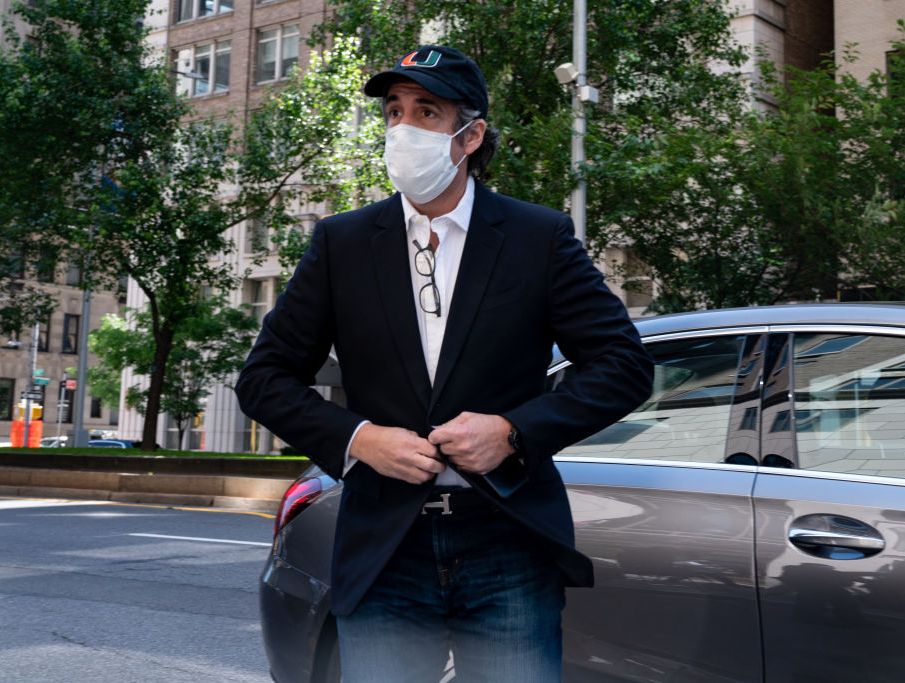 michael cohen wearing a facemask after exiting a car in new york city