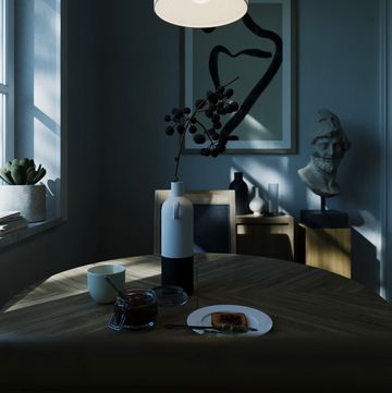 a table with a plate of food and a lamp on it