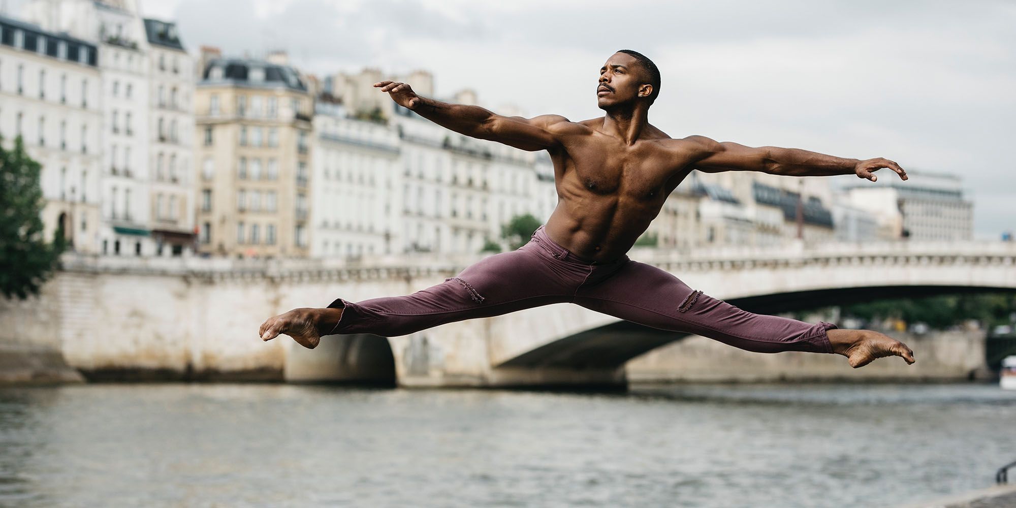 Young Male Ballet Dancer Posing Near Barre, Man Practicing Stock Photo -  Alamy
