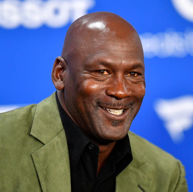 michael jordan smiling while talking to reporters