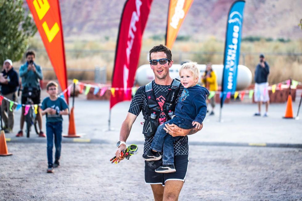 Michael McKnight and son at the finish line of the Moab 240 in 2019.