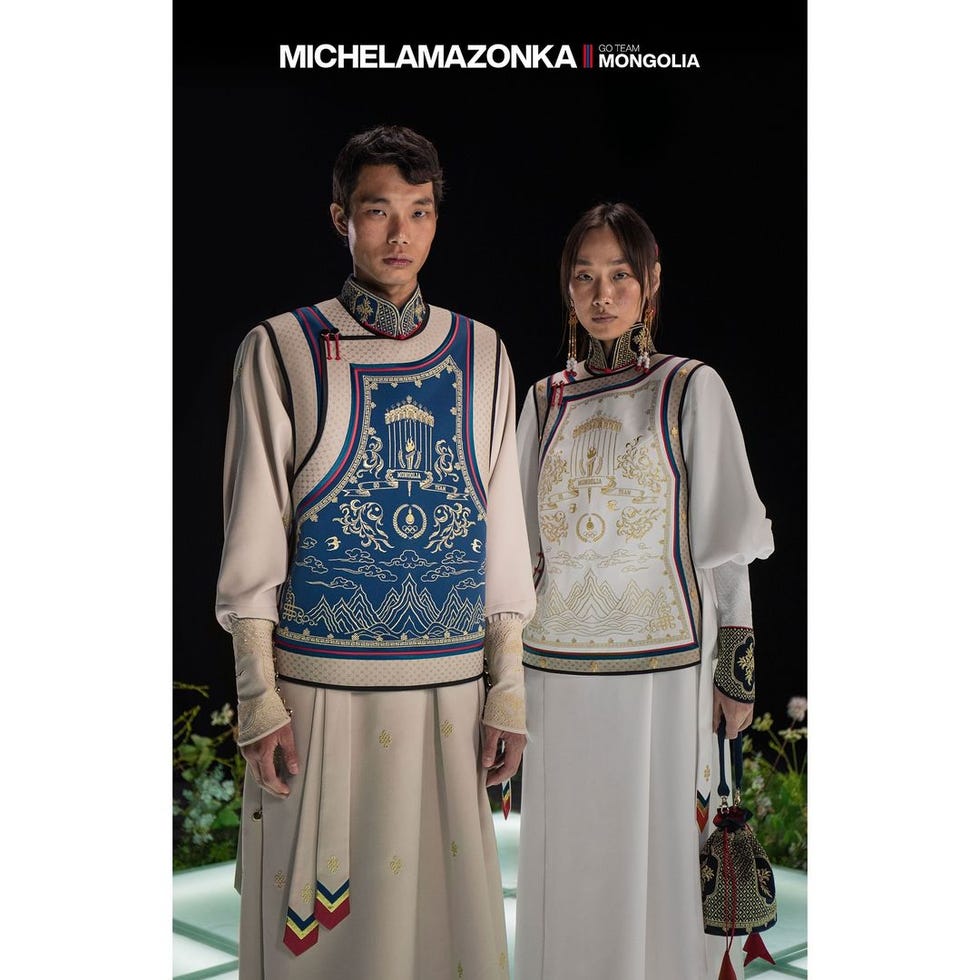 a man and woman wearing traditional clothing