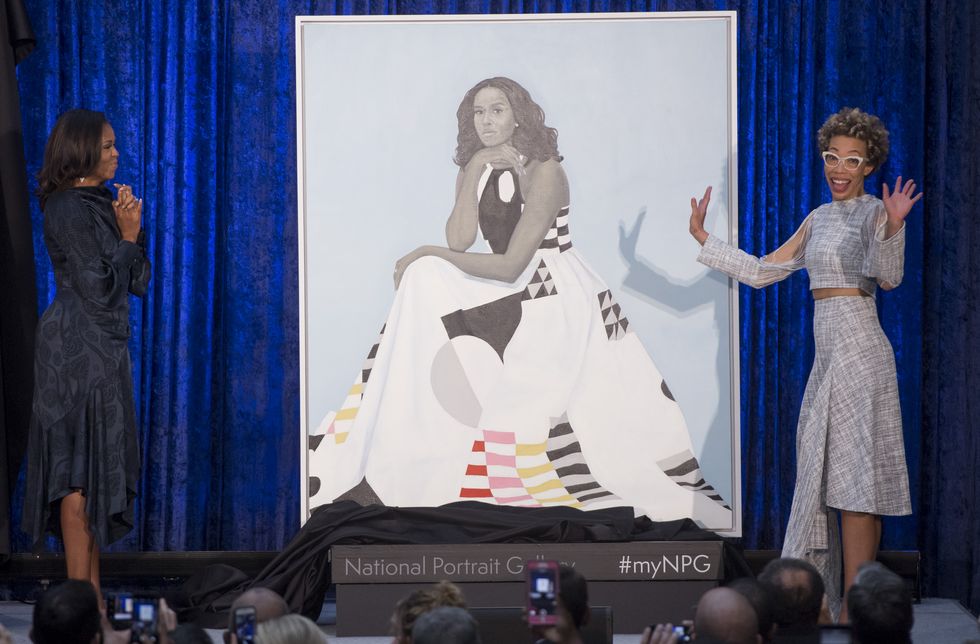 topshot   former us first lady michelle obama l and artist amy sherald r unveil mrs obamas portrait at the smithsonians national portrait gallery in washington, dc, february 12, 2018 photo by saul loeb  afp  restricted to editorial use   mandatory mention of the artist upon publication   to illustrate the event as specified in the caption photo by saul loebafp via getty images