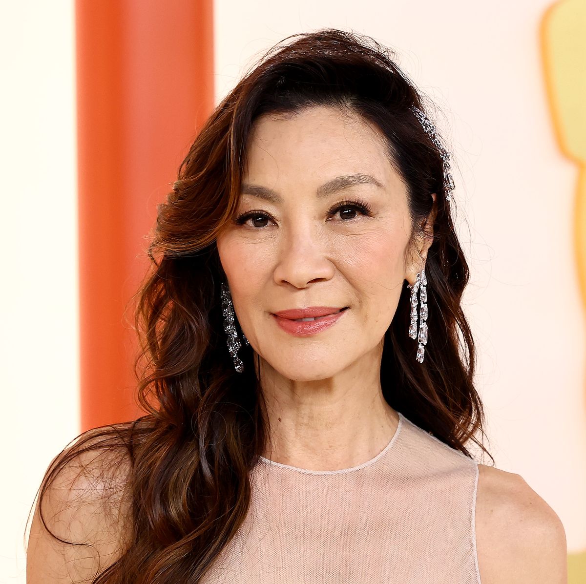 Michelle Yeoh slays her airport look in a chic Dior trench coat