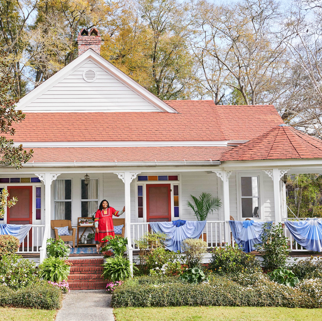 a woman on her farmhouse porch