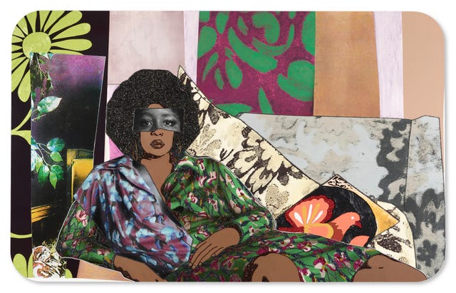 a person reclining on a colorful patterned couch