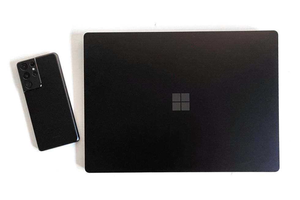 closed microsoft surface 4 laptop with phone